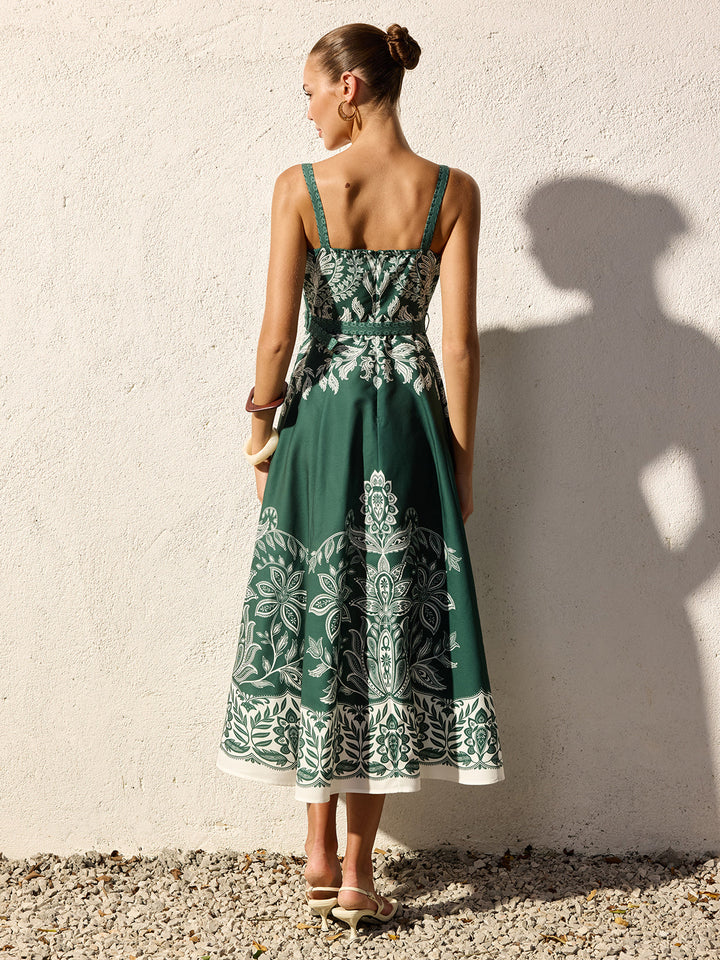 Model wearing a flowing maxi dress with a simple square neck design.