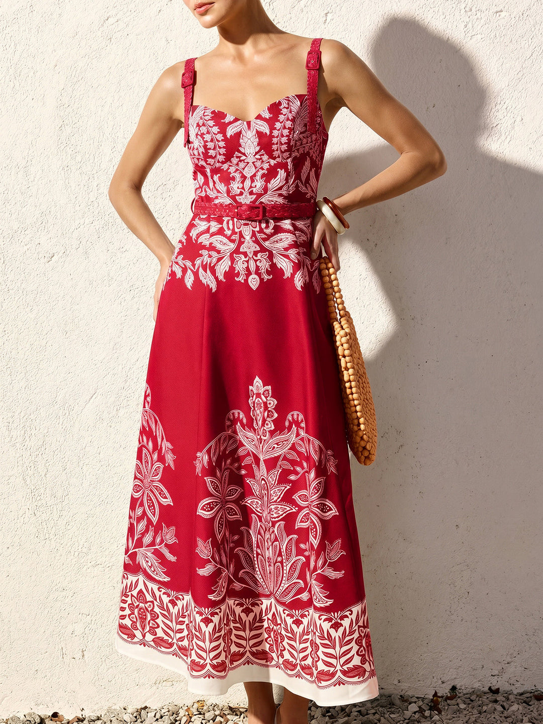 Female model in a sleeveless woven dress with a long relaxed silhouette.