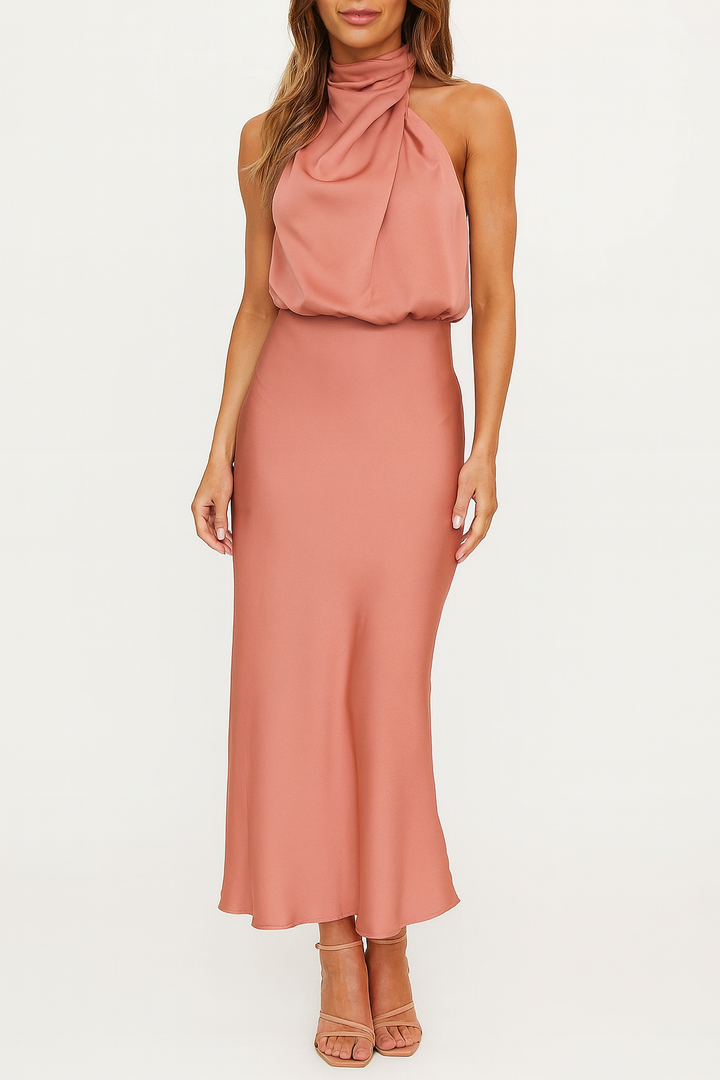 Woman in a flowing satin midi dress styled on a plain background.
