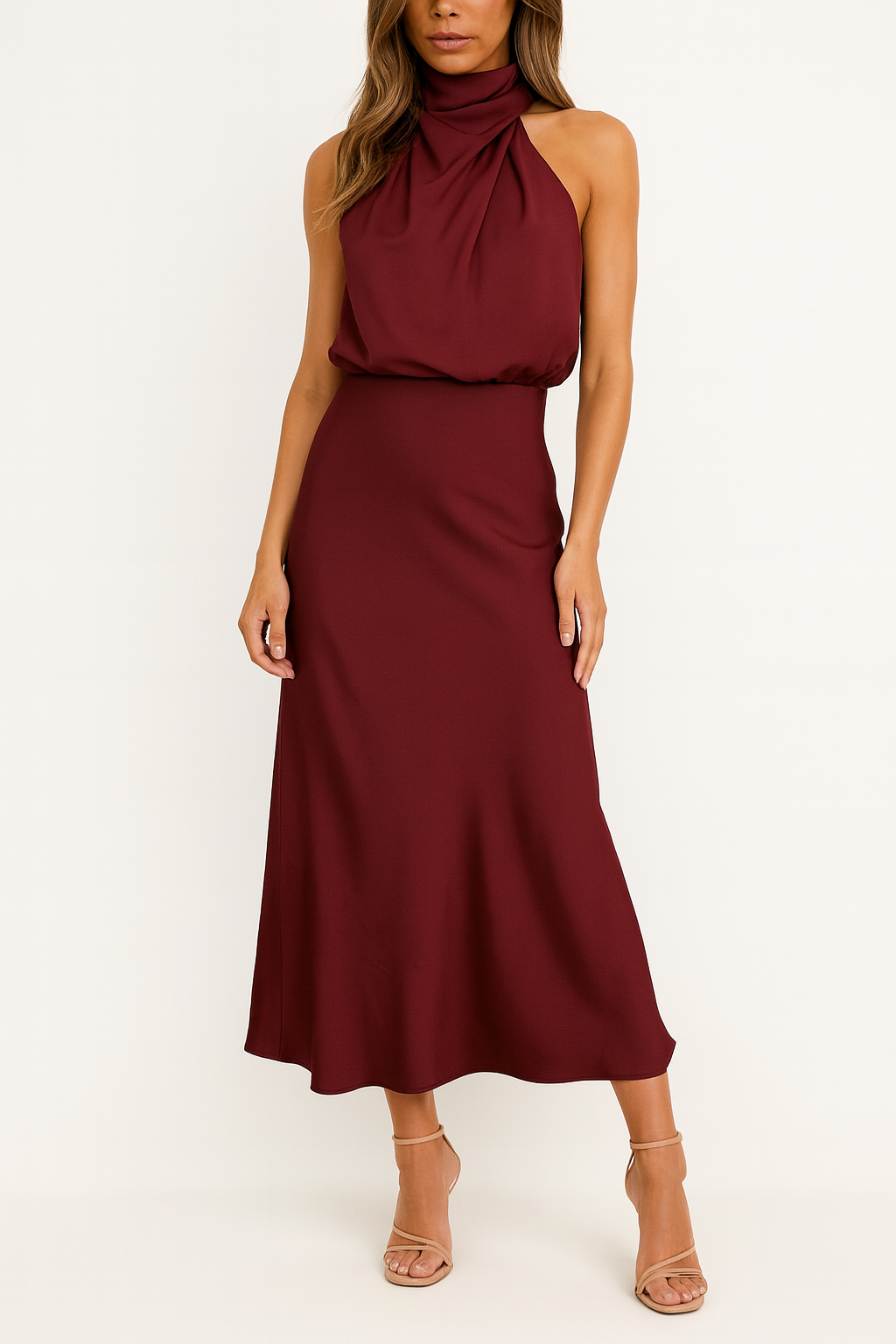 Female model showcasing a draped off-shoulder evening dress on a plain backdrop.