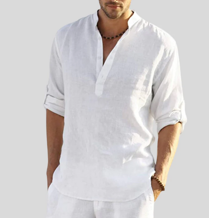 Male model wearing a casual V-neck shirt against a plain background.