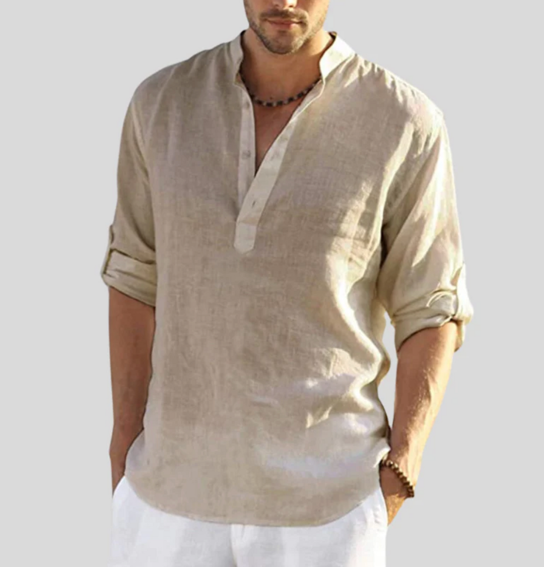Male model in a relaxed band collar shirt on a plain background.