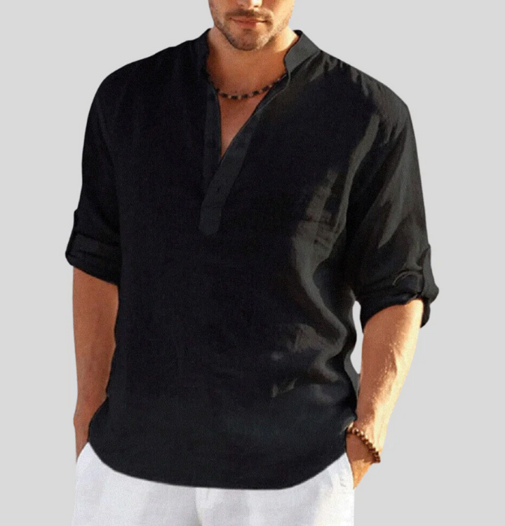  Male model in a loose fit V-neck shirt against a plain background.