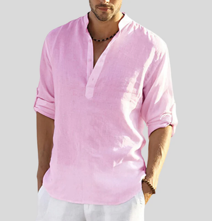 Male model wearing a relaxed summer shirt with a curved hem.