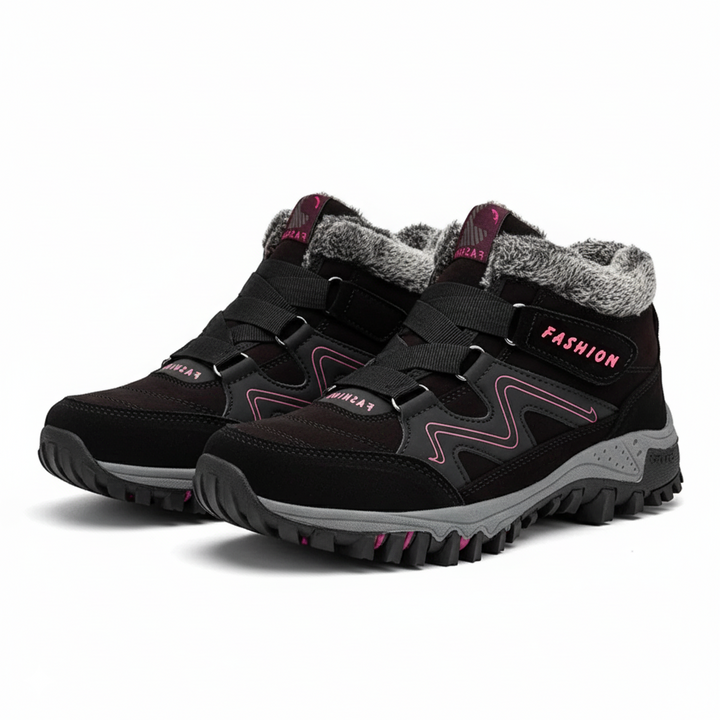 Female model showing everyday waterproof boots with side foot angle on a plain background.