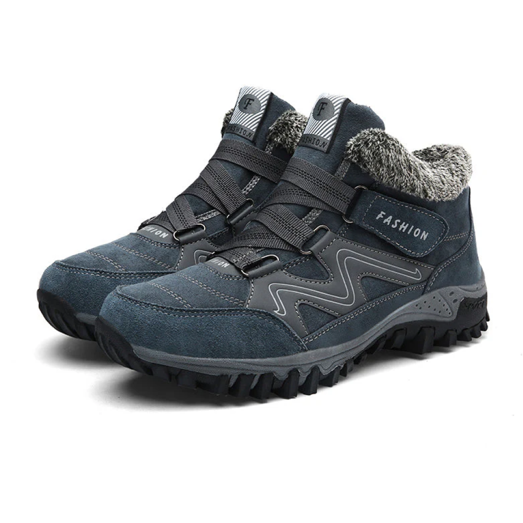 Female model displaying supportive waterproof boots against a plain background.