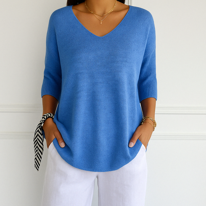 V-neck knit top displayed from front on plain background.