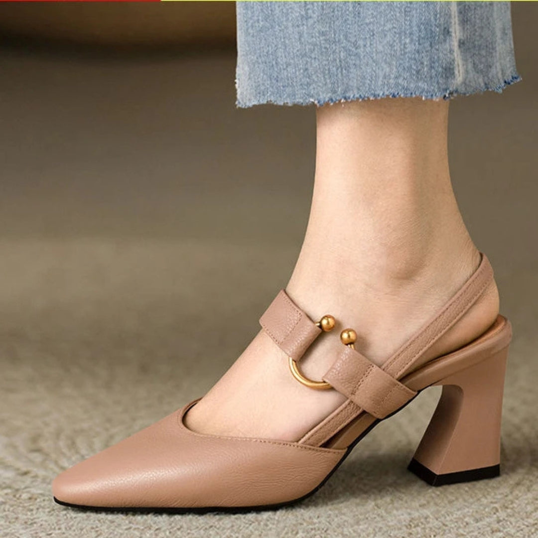  Woman wearing open-toe comfort heels displayed on a plain background.