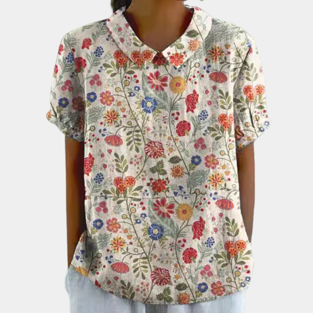 Front view floral blouse short sleeves on plain background display