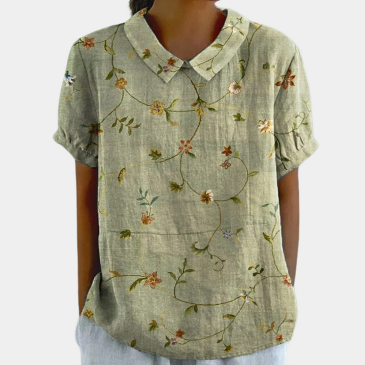 Front folded blouse on plain background showing overall shape