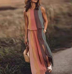 Sleeveless patterned maxi dress styled on a woman with a plain background.