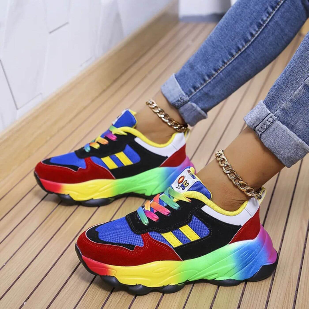 Female model showing lightweight lace-up sneakers on a plain background.

