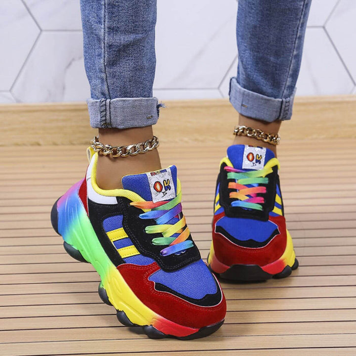 Close-up of women’s cushioned walking shoes displayed on a plain backdrop.