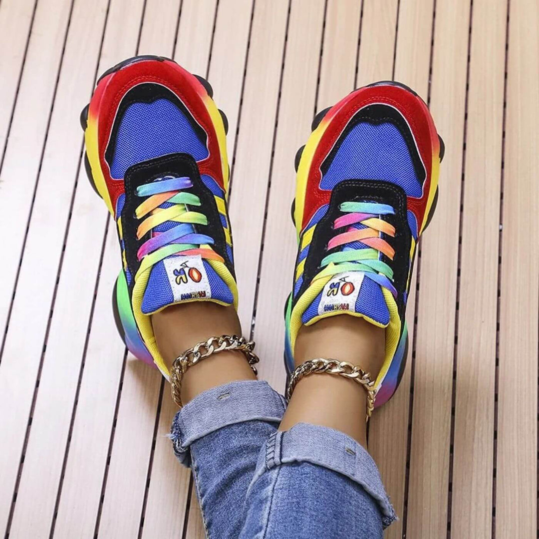 Woman wearing breathable everyday sneakers on a plain background.
