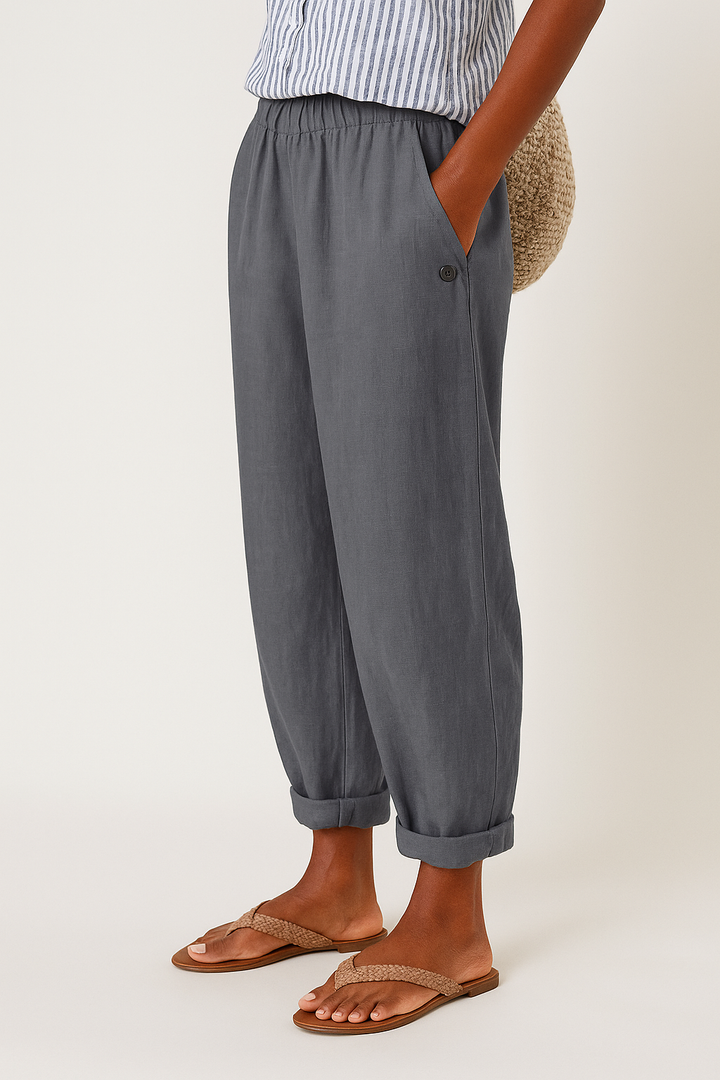 Female model wearing flattering high-waist pants with side pockets.