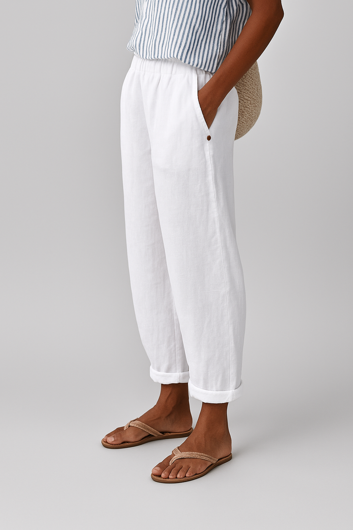 Woman posing in stylish pocket pants against a clean background.