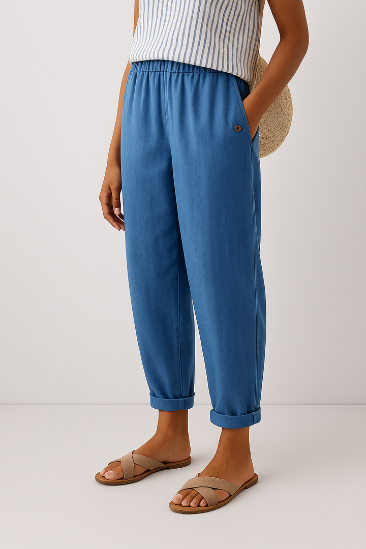 Female model showcasing tailored women’s pants with practical pockets.