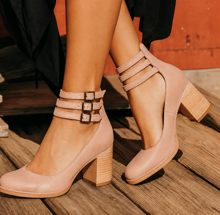 Female foot displaying stylish women’s footwear with clean background.