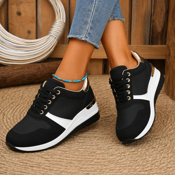 Woman wearing cushioned slip-on shoes displayed against a plain background.