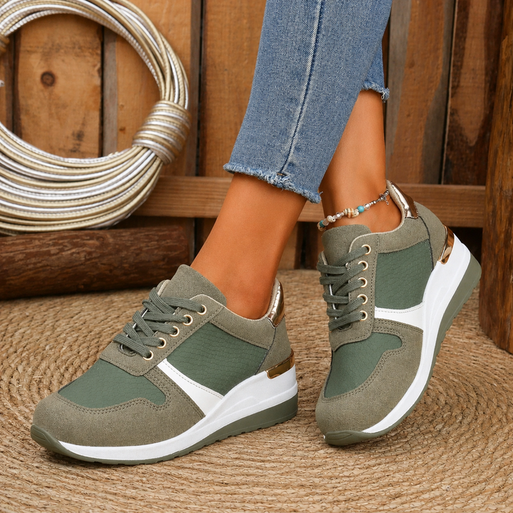 Female model showing feet wearing lightweight comfort shoes on a plain background.