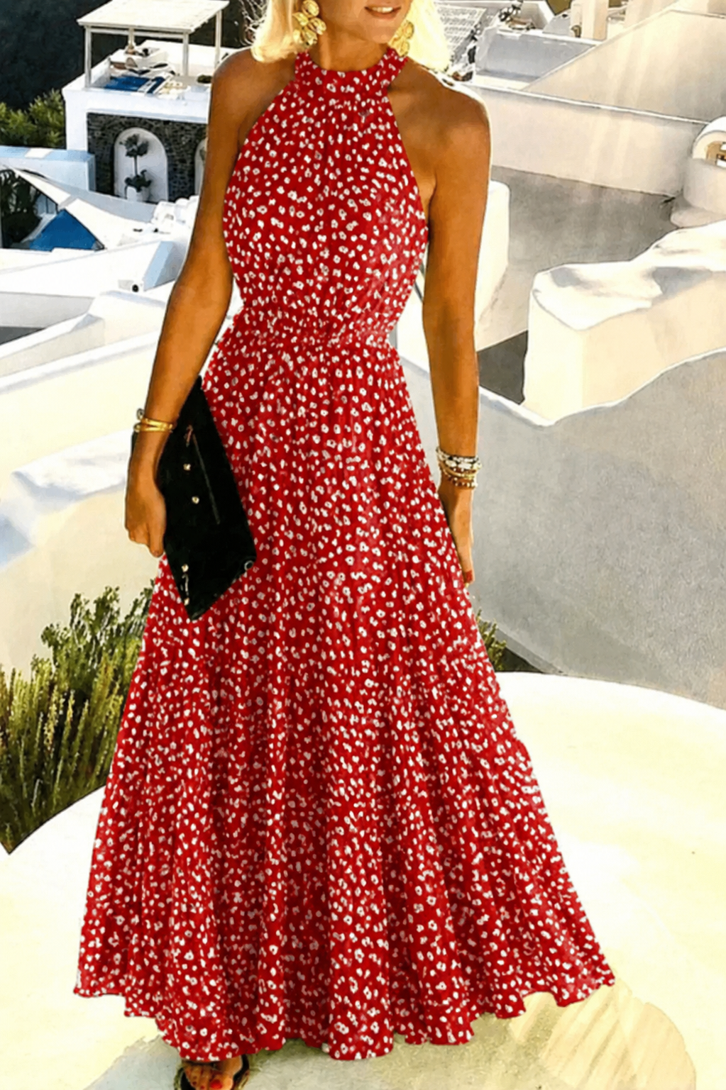 Female model in a halter maxi dress featuring a flowing skirt against a plain background.
