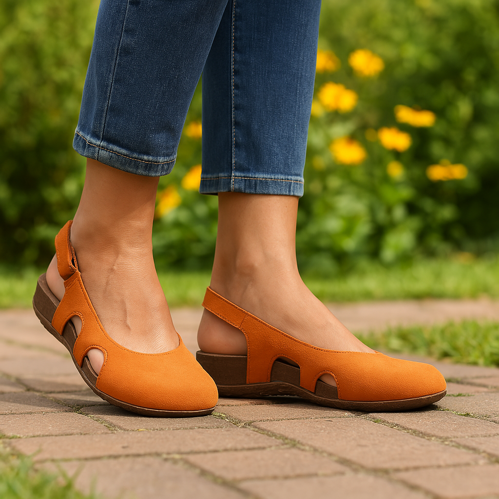 Female model wearing casual open toe sandals with cushioned footbed on a plain background.