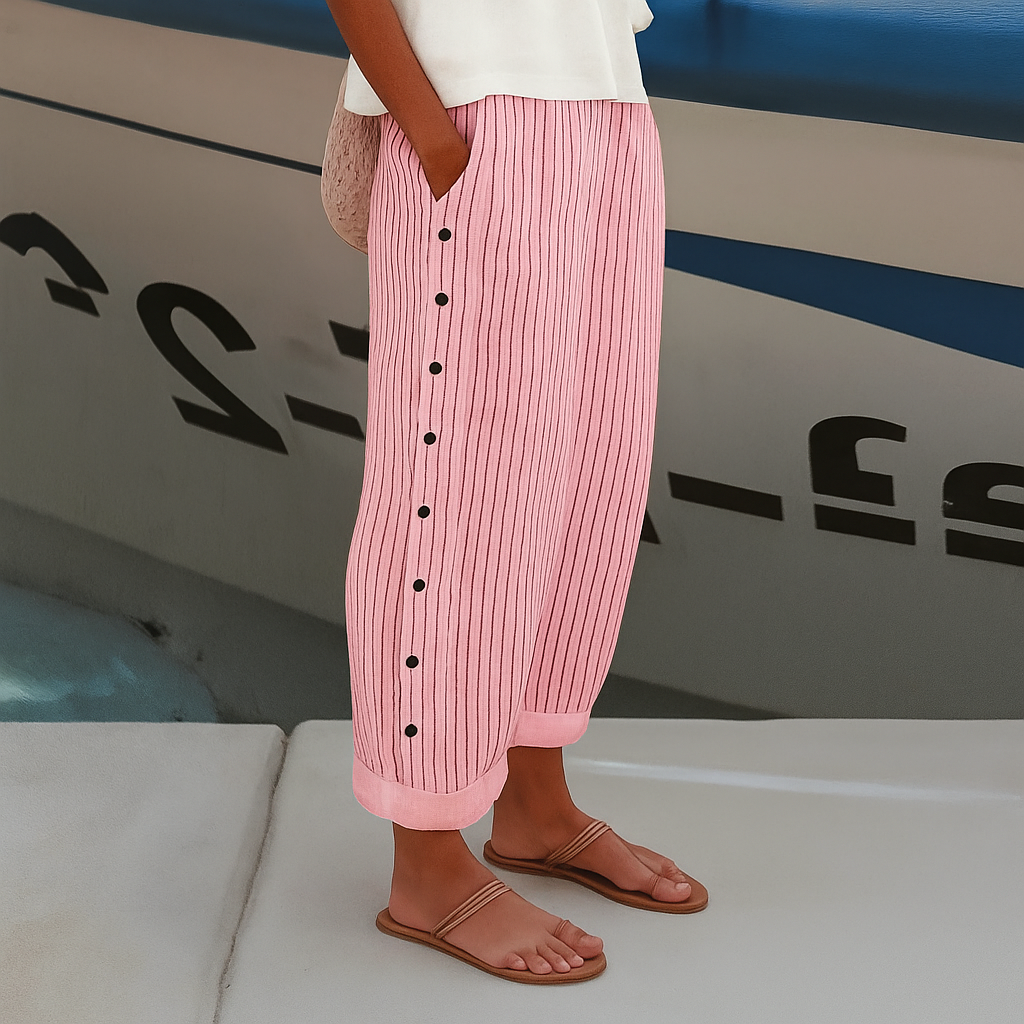Woman in breathable casual trousers with side pockets standing on a clean background.