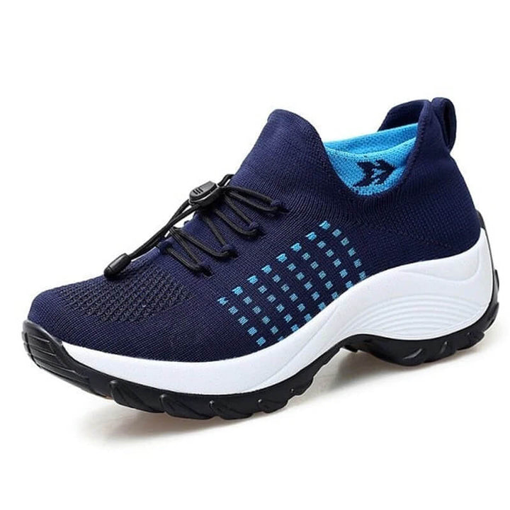 Cushioned casual shoes on a plain background.