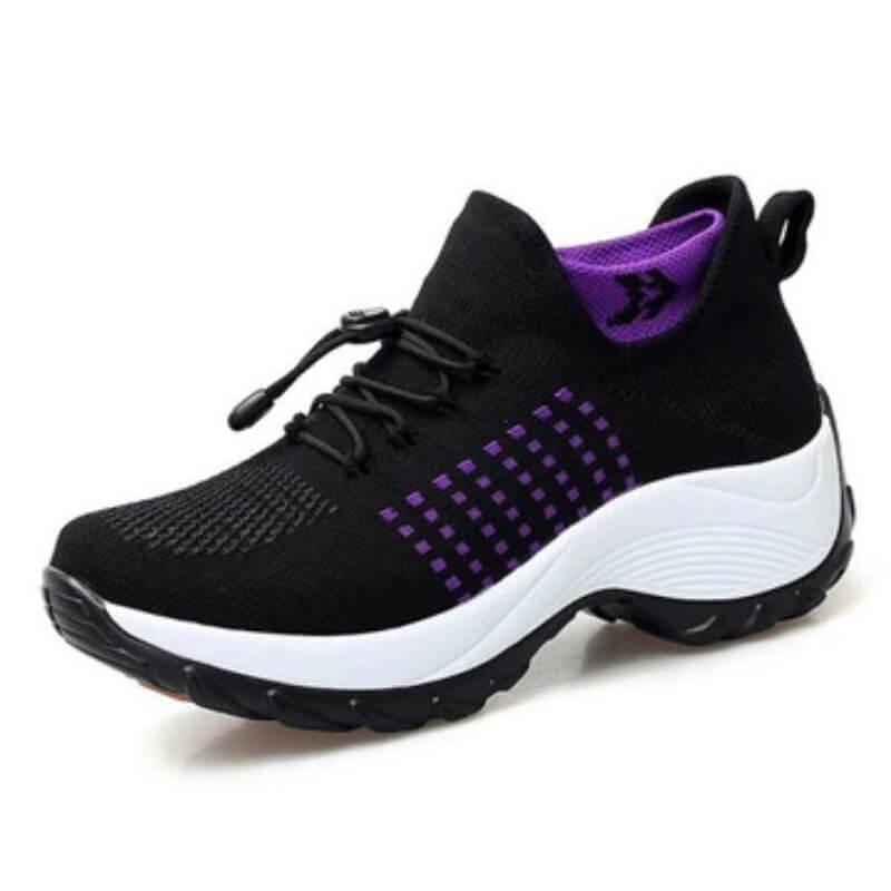 Supportive walking shoes on a plain background.