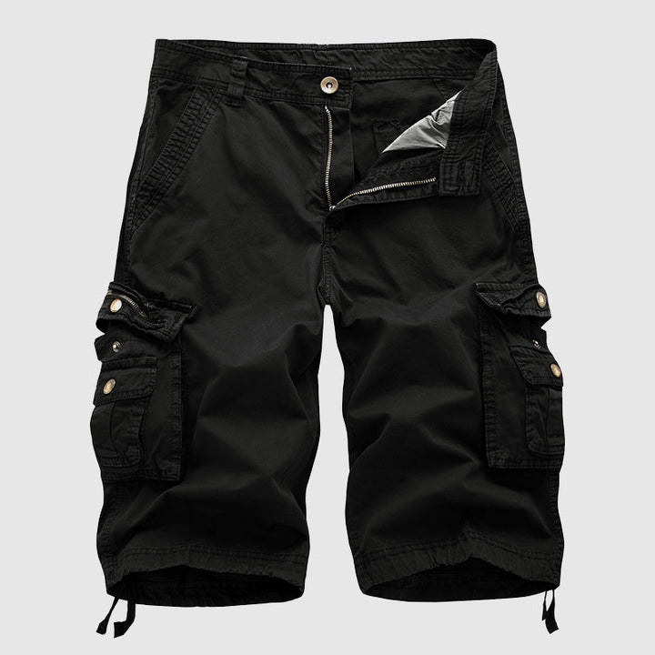 Relaxed fit utility shorts on a plain background.