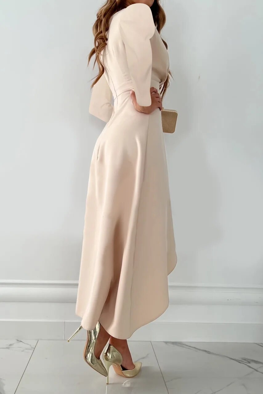 Female model in a sleek V neck midi dress with a refined summer look on a plain background.