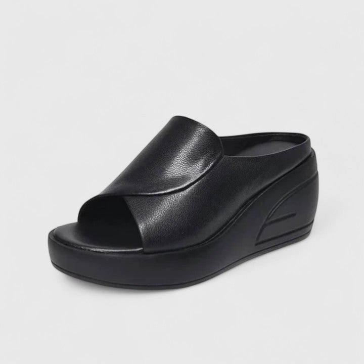 Supportive orthopedic wedge sandals shown on a plain background with cushioned footbeds.