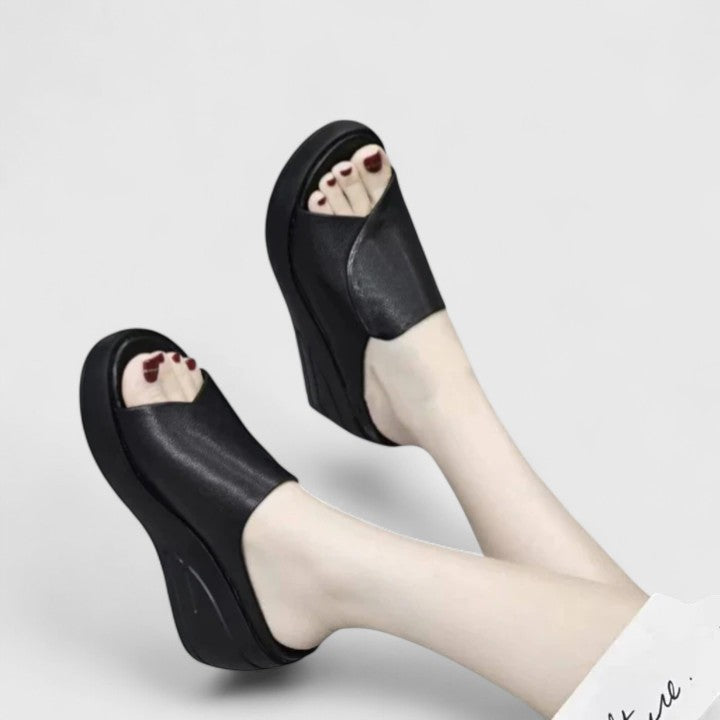 Comfortable wedge sandals displayed on a clean background for casual daily walking support.