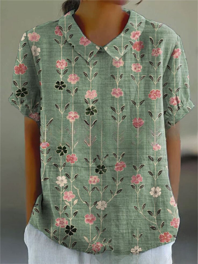 Refined floral blouse styled for casual and workwear outfits.