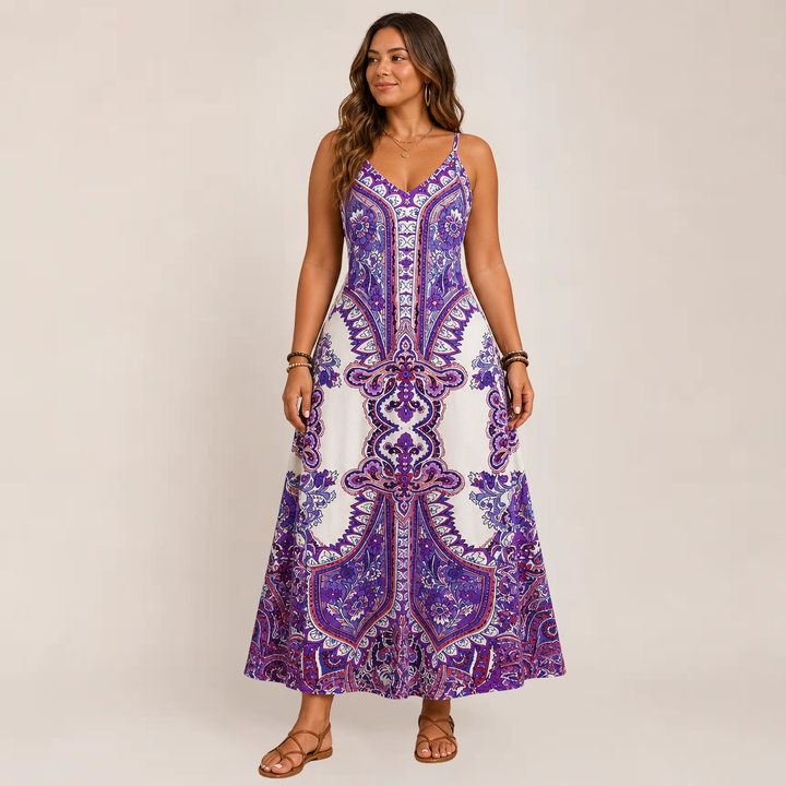 Model wearing a sleeveless maxi sundress with a relaxed flowing shape on a plain background.