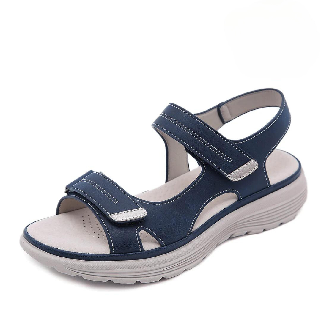 Elegant comfort sandal against a plain background.