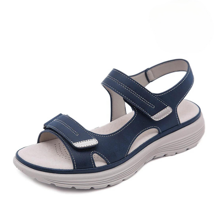 Elegant comfort sandal against a plain background.