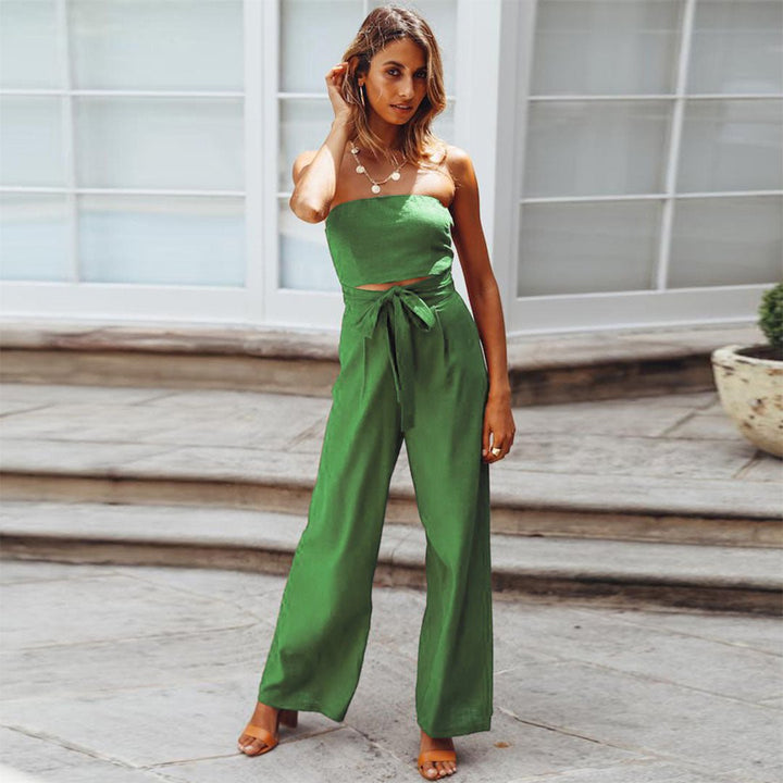 Female model showcasing a strapless one-piece outfit with wide-leg trousers.