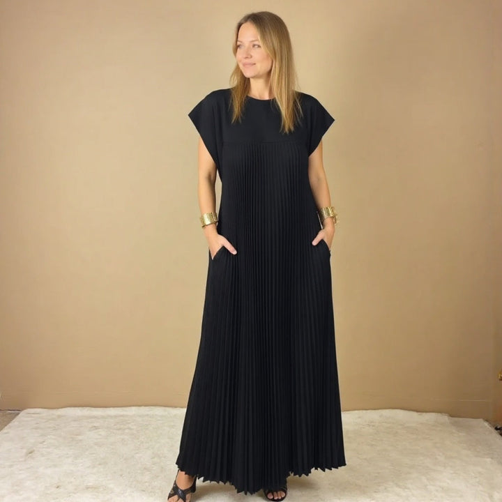 Long sleeveless maxi dress shown on a female model against a plain backdrop.