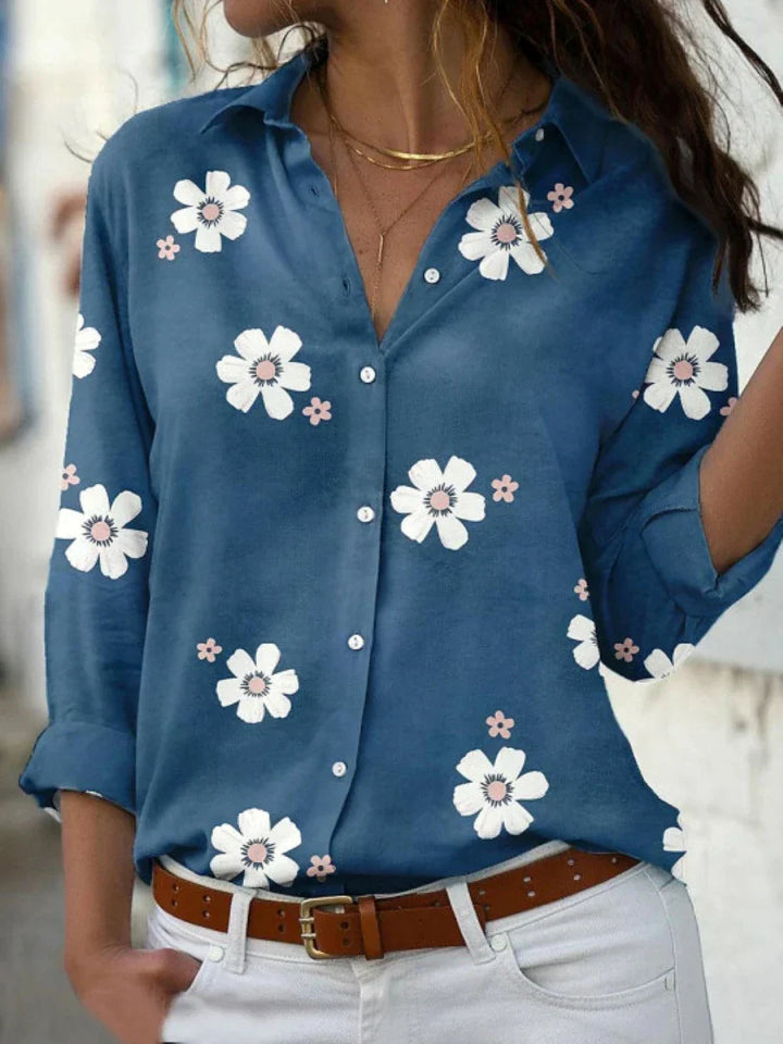 Airy floral blouse worn by a model on a clean background emphasizing comfort and style.