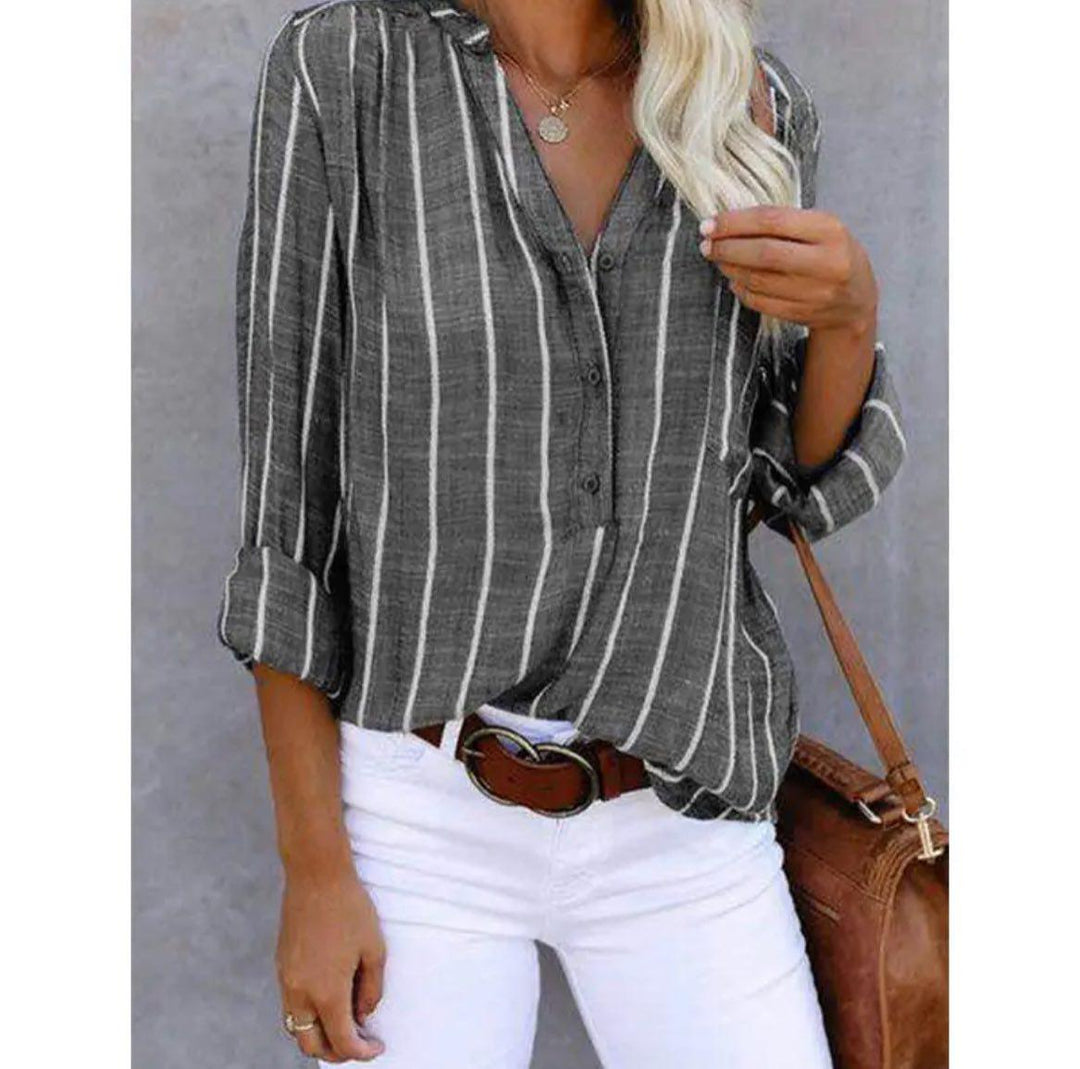 Classic striped blouse on a plain background designed for effortless casual and refined outfits.