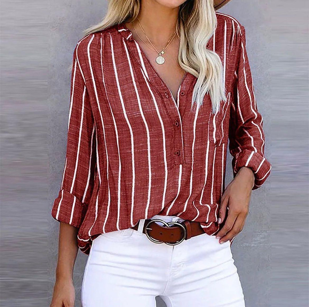 Women’s striped blouse on a plain background with a relaxed fit and timeless everyday style.