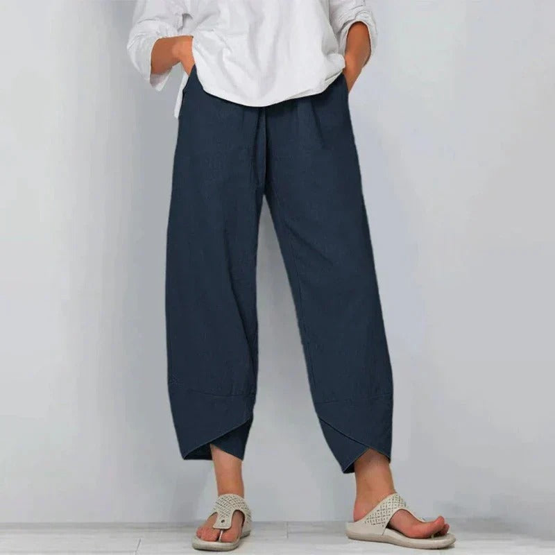 Female model showcasing high-waist summer pants on a clean background.