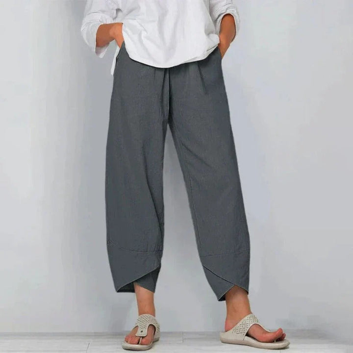 Model wearing breathable women’s summer trousers against a plain background.