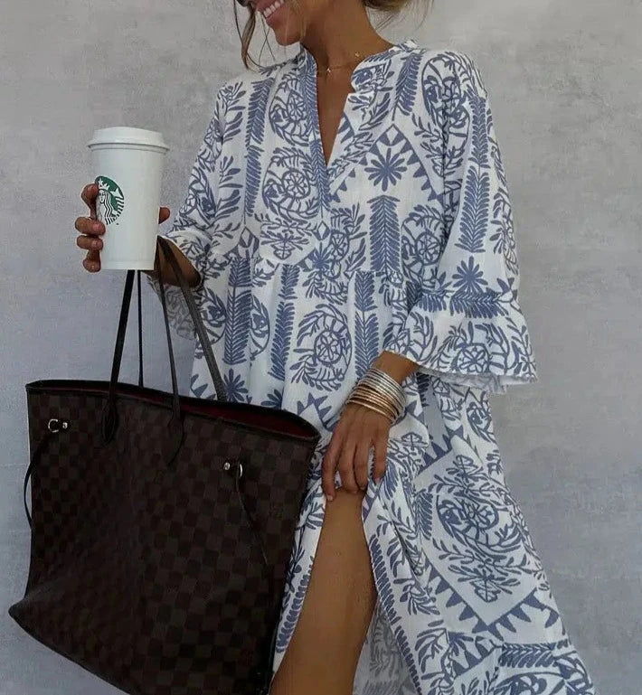 Blue tile print V-neck swing dress shown on a plain background.