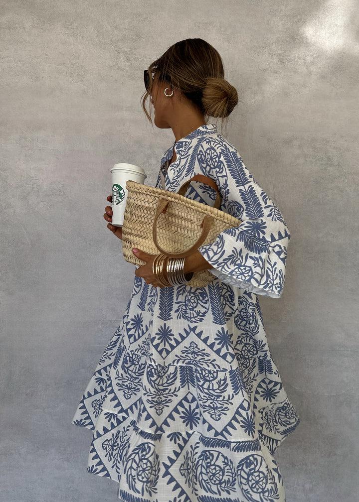Breezy blue and white A-line dress with 3/4 sleeves.