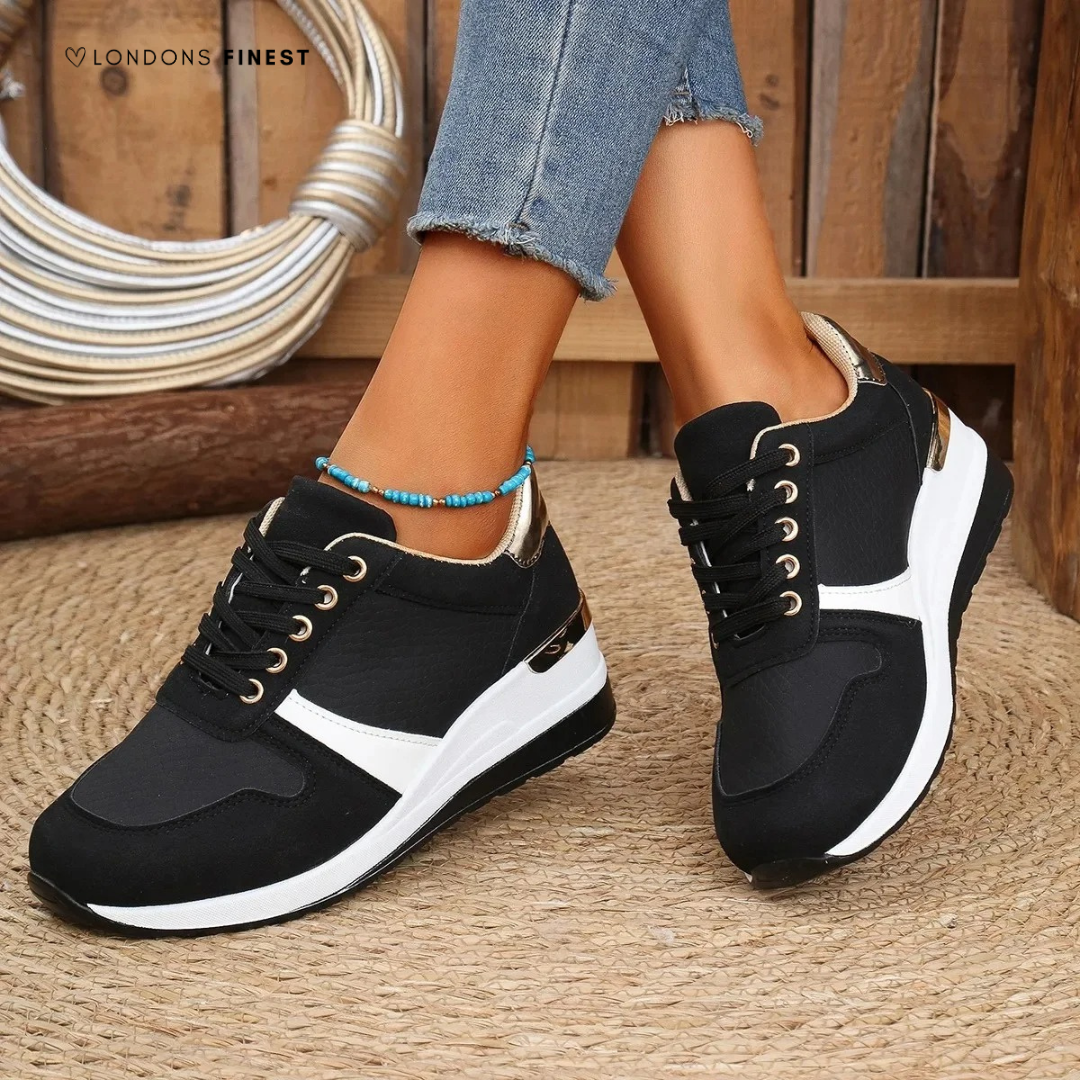 Stylish women’s slip-on shoes displayed against a plain backdrop.