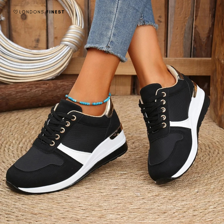 Stylish women’s slip-on shoes displayed against a plain backdrop.