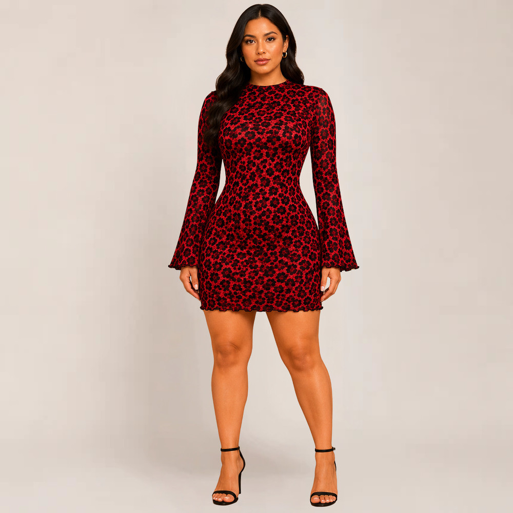 Woman posing in a fitted leopard print mini dress with long sleeves on a plain background.