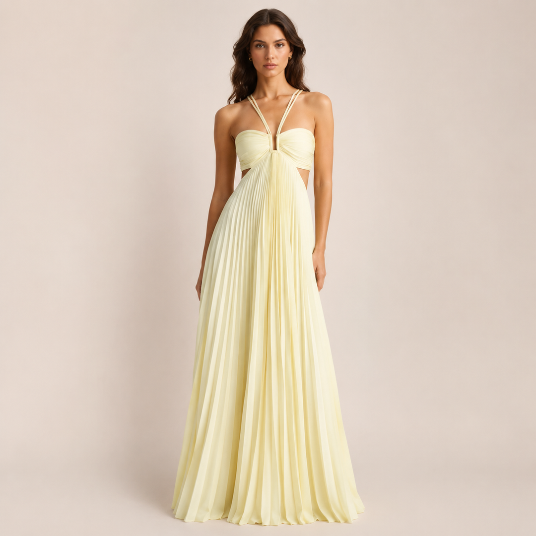 Female wearing a light yellow backless floor-length dress on a plain background.